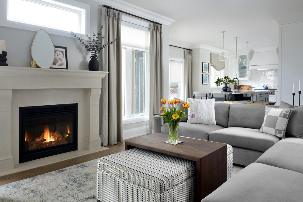 a living room with a fireplace and a couch